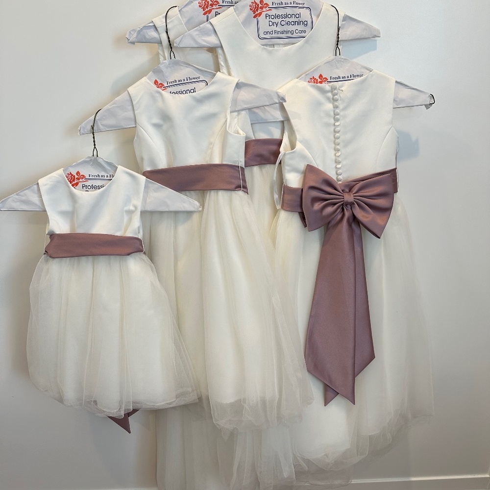 David’ Bridal Flower Girl Dresses Ivory with mauve or Ivory bow.